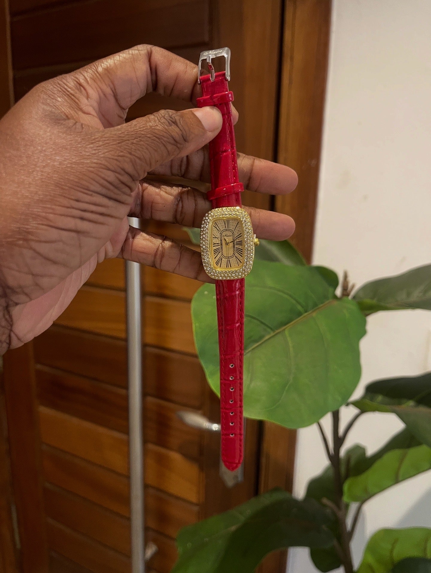 red detailed wristwatch