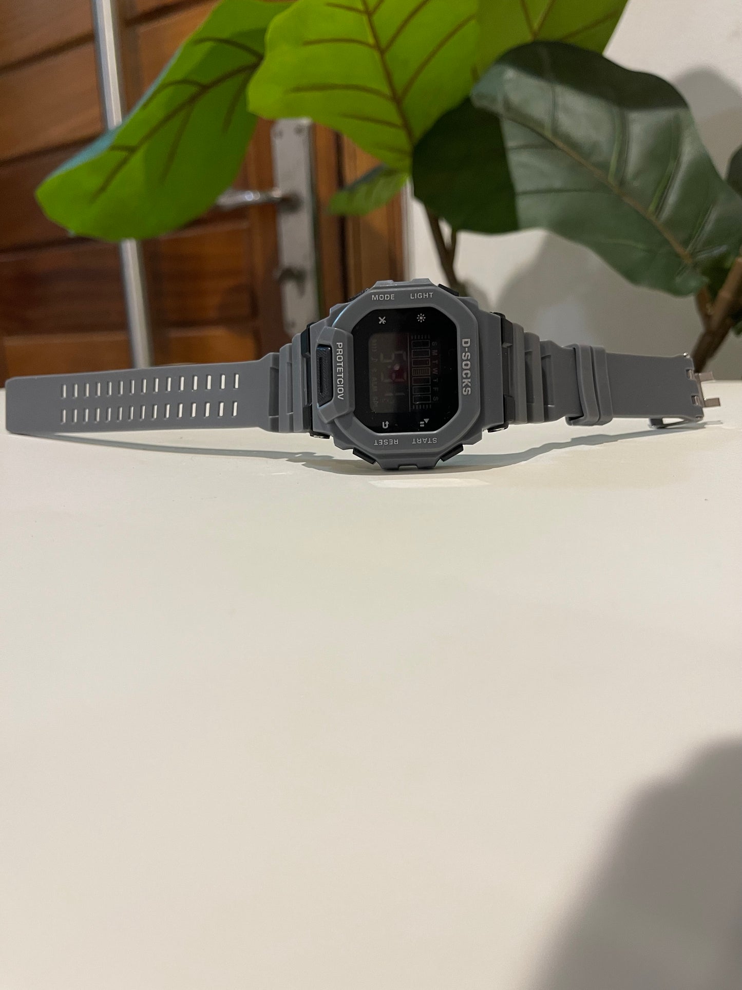 Gray Digital watch with alarm nd light with timer