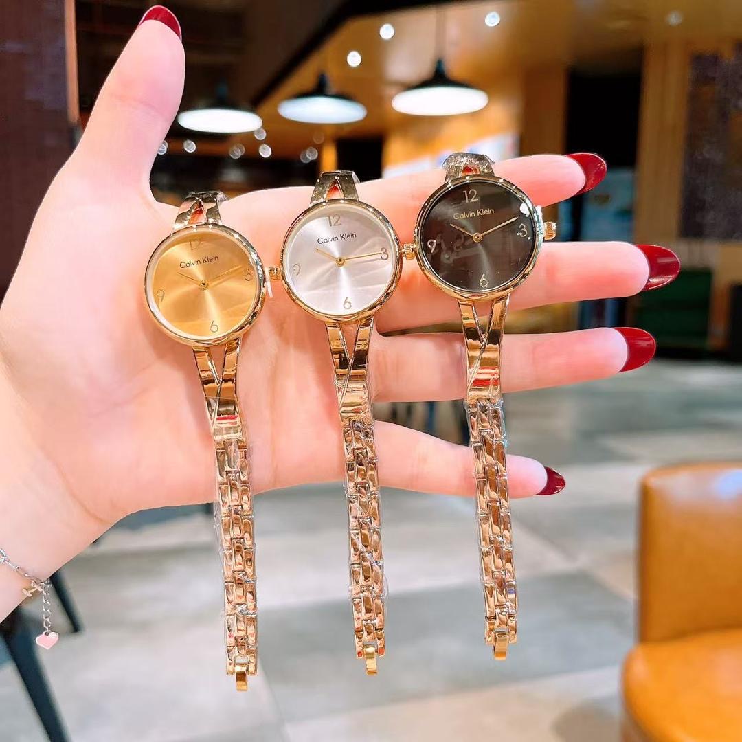 wrist watch with gold detailing