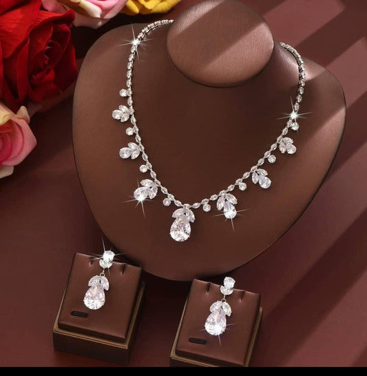 Detailed neckpiece and earrings