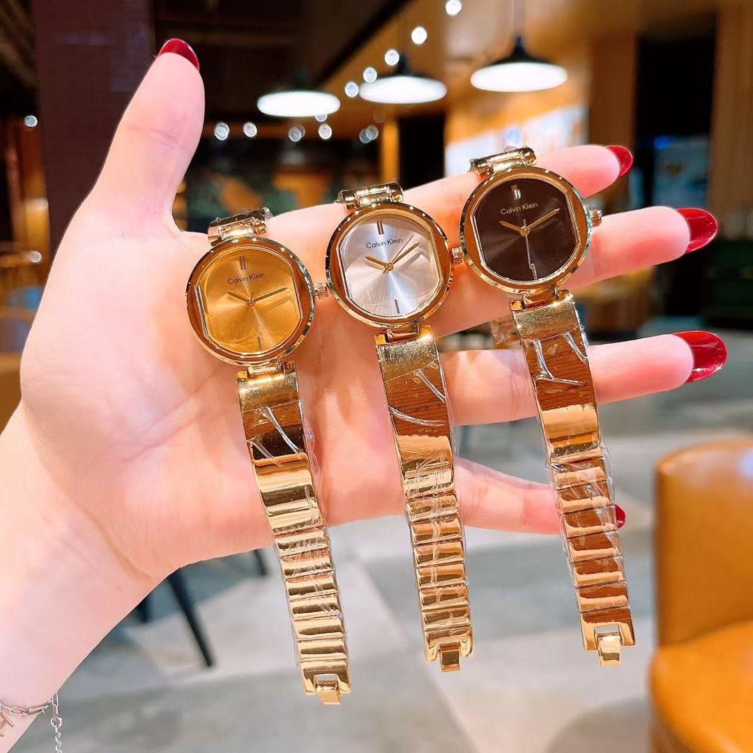 wrist watch with gold detailing random selection