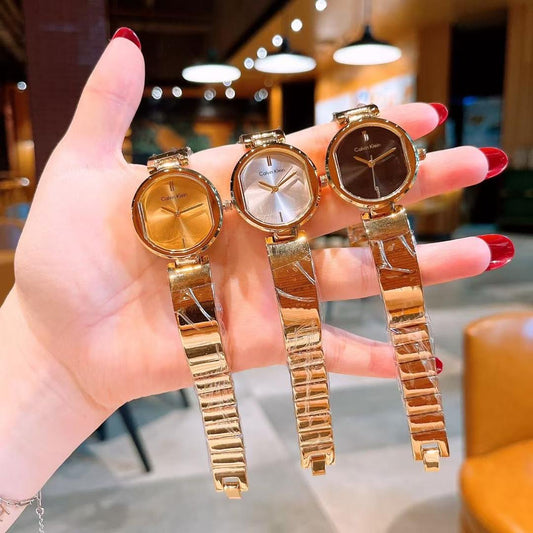 wrist watch with gold detailing random selection