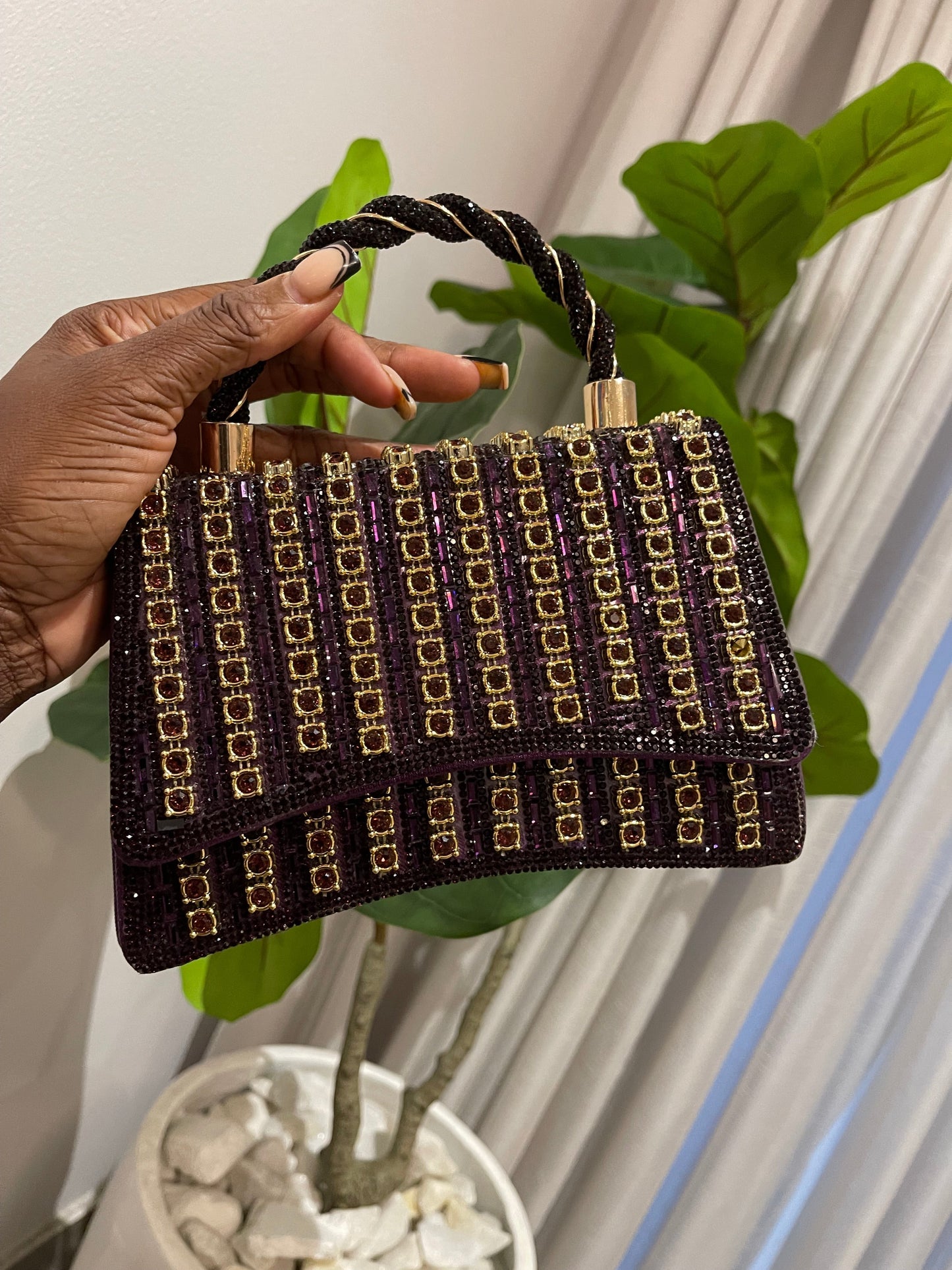 Purple mini bag with strap and gold detailing