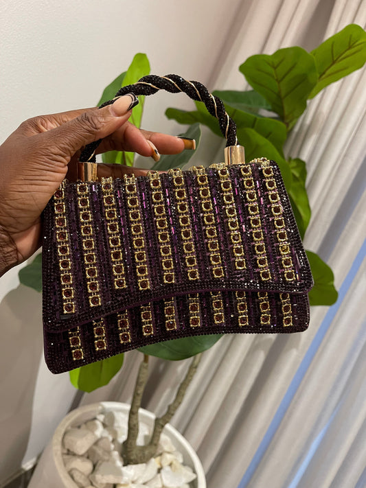 Purple mini bag with strap and gold detailing