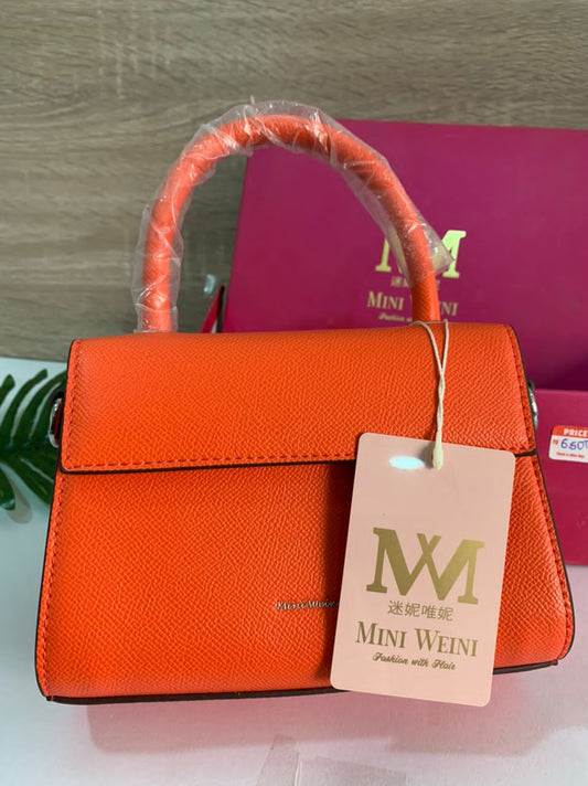 orange leather bag with box