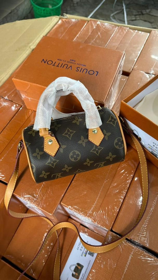 Brown monogrammed bag with box