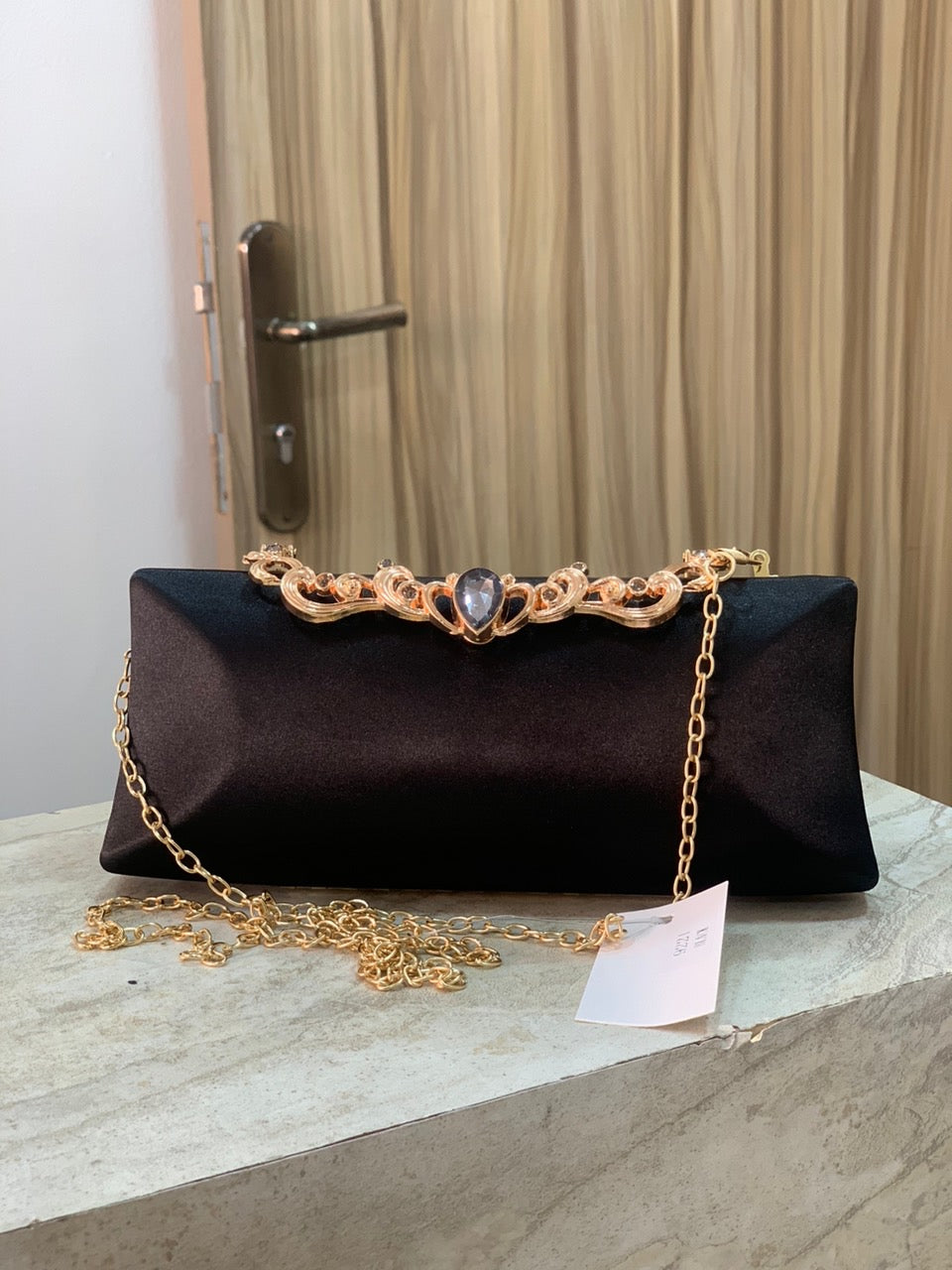 Black purse with gold detail