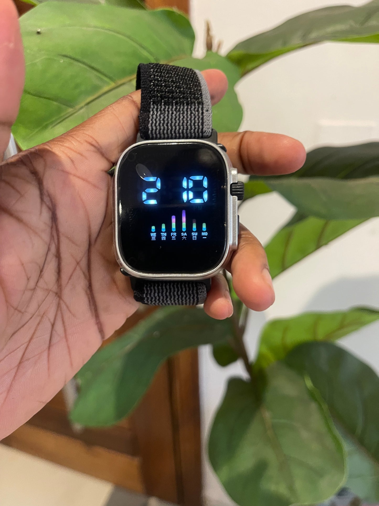 Digital wristwatch with adjustable strap